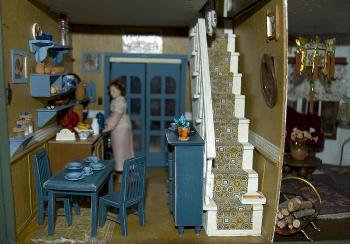 Featured is an interior photo of a Dollhouse.  Dollhouse and Photographer unknown.